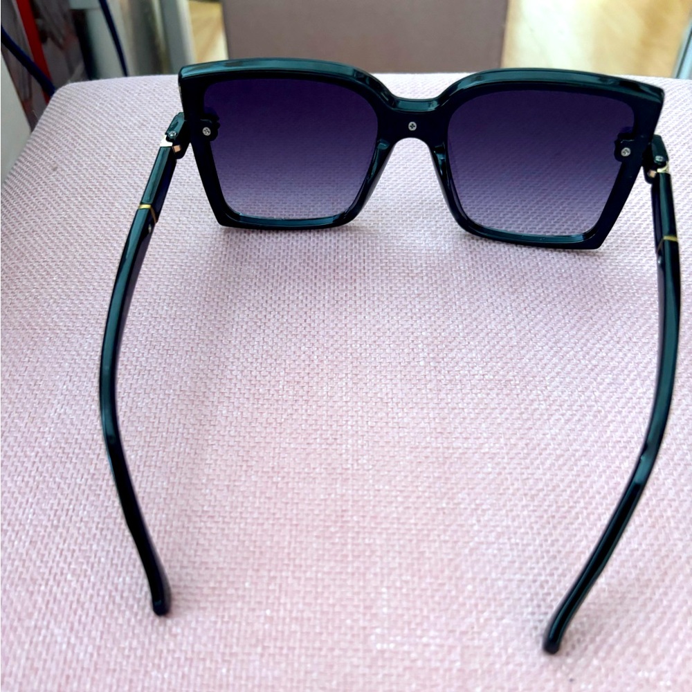 Black and gold plastic sunglasses